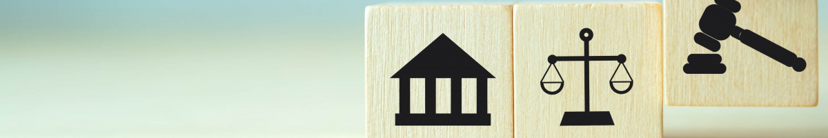 Symbols of a courthouse, set of scales, and a gavel represent the justice system.